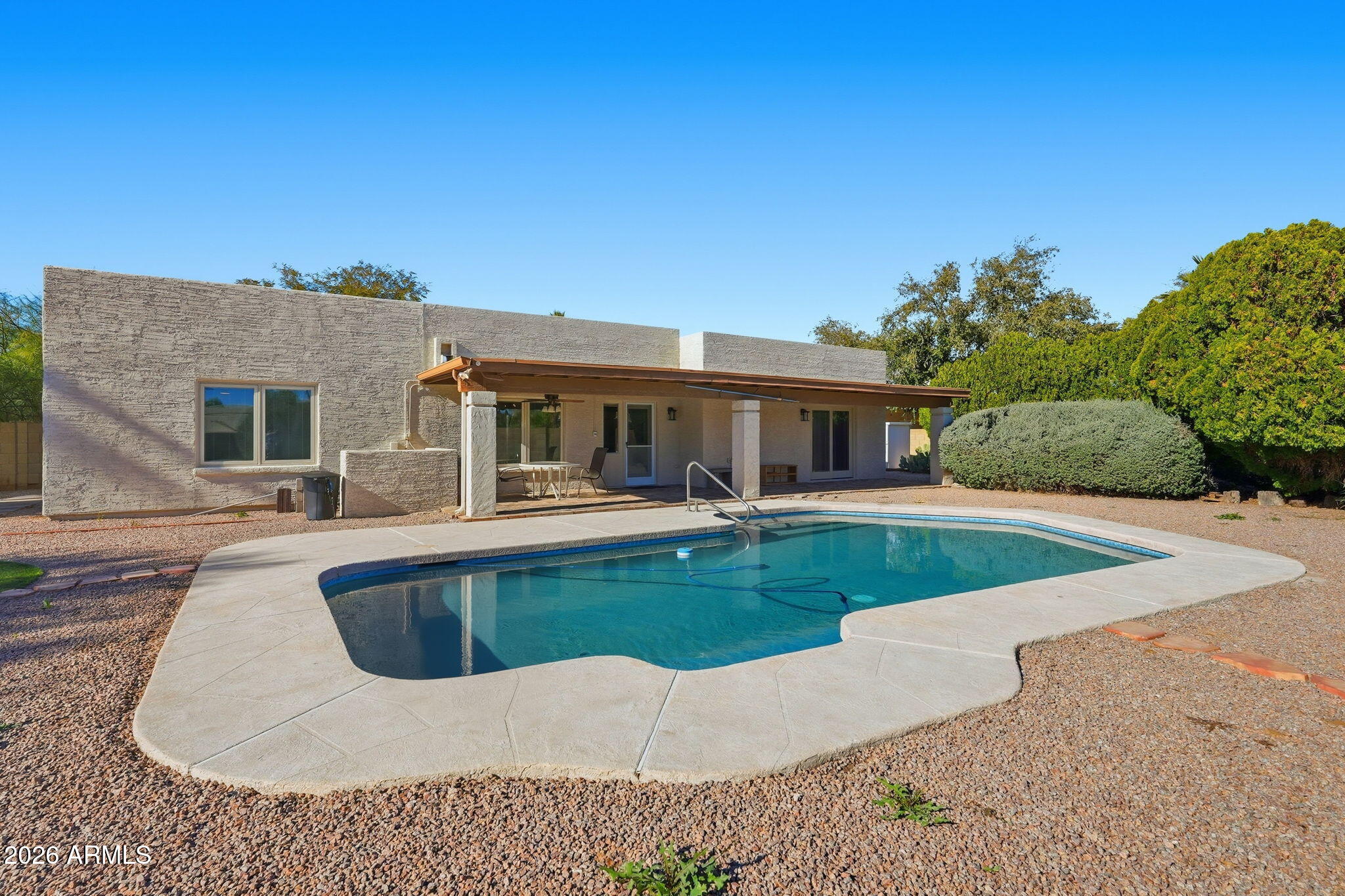 6615 East Phelps Road Scottsdale, AZ 85254 - Photo 44 of 53 a view of a house with swimming pool