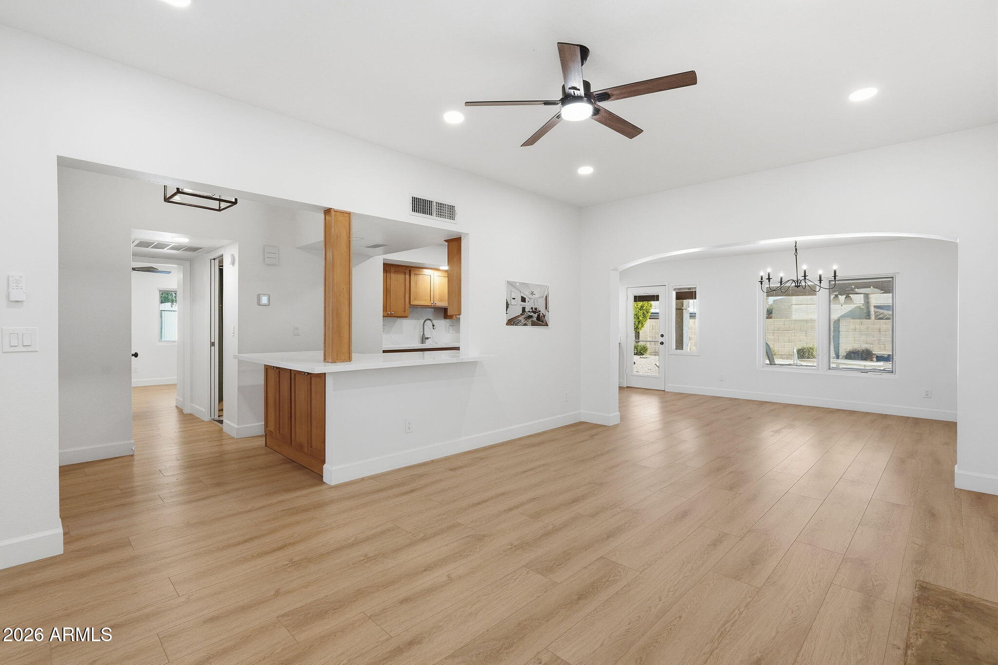 6615 East Phelps Road Scottsdale, AZ 85254 - Photo 9 of 53 a view of an empty room with window and wooden floor