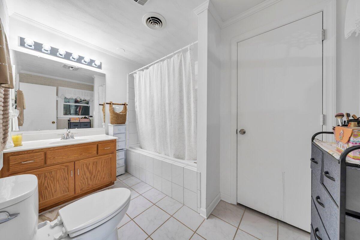 3226 Rakes Road Rocky Mount, VA 24151 - Photo 32 of 74 a bathroom with a granite countertop sink mirror vanity and toilet