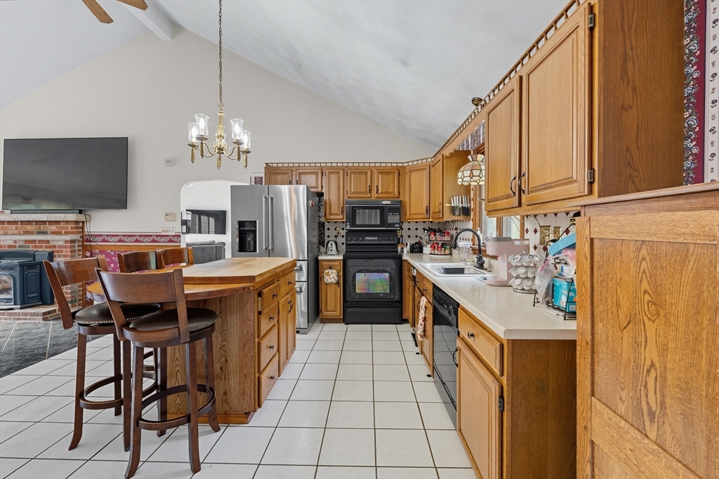 45 Red Gate Road Tyngsborough, MA 01879 - Photo 11 of 42 a kitchen with stainless steel appliances granite countertop a sink and cabinets