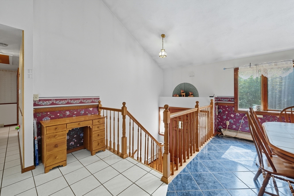 45 Red Gate Road Tyngsborough, MA 01879 - Photo 15 of 42 a view of a livingroom with furniture and staircase