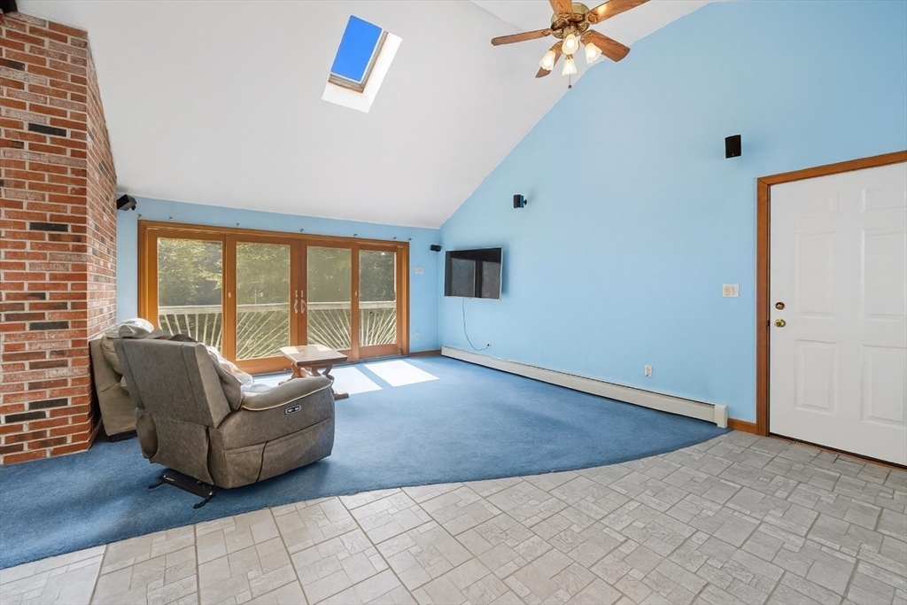 45 Red Gate Road Tyngsborough, MA 01879 - Photo 16 of 42 an empty room with windows and ceiling fan