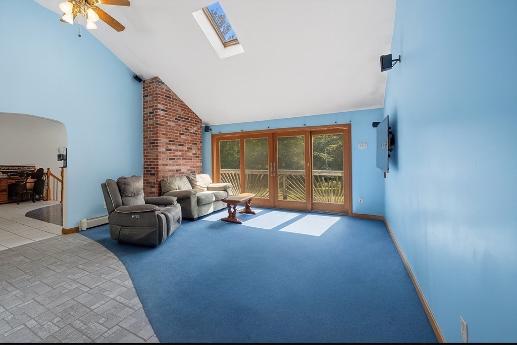 45 Red Gate Road Tyngsborough, MA 01879 - Photo 18 of 42 a living room with furniture and a large window