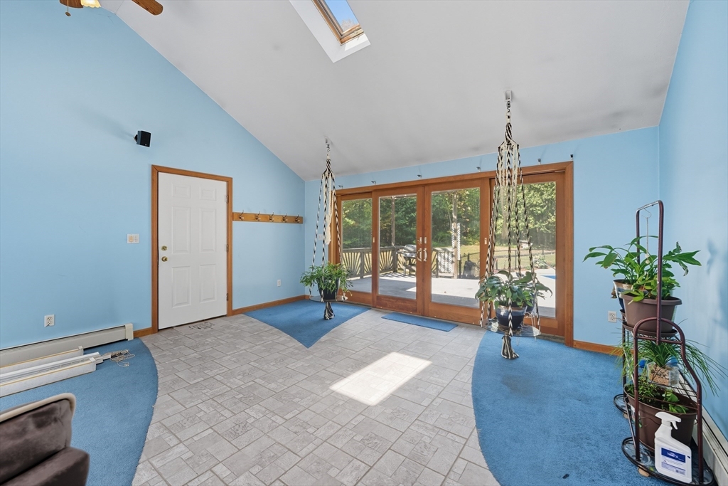 45 Red Gate Road Tyngsborough, MA 01879 - Photo 20 of 42 a living room with furniture and a potted plant