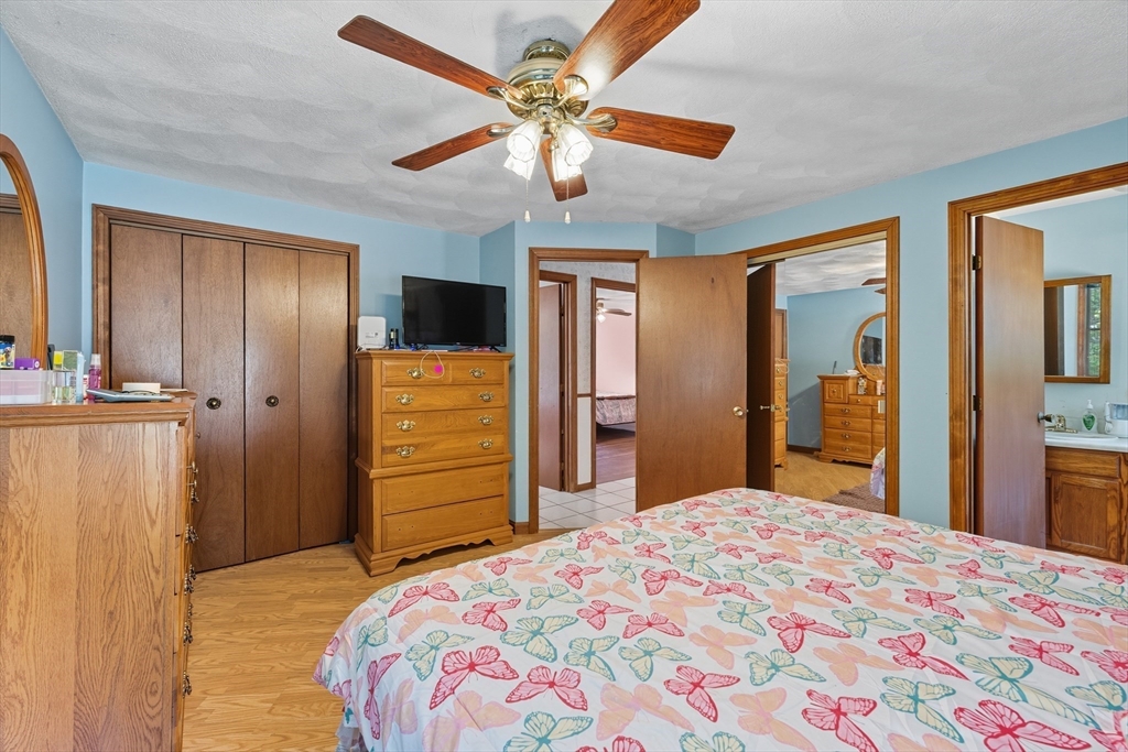 45 Red Gate Road Tyngsborough, MA 01879 - Photo 22 of 42 a bedroom with a bed and a dresser