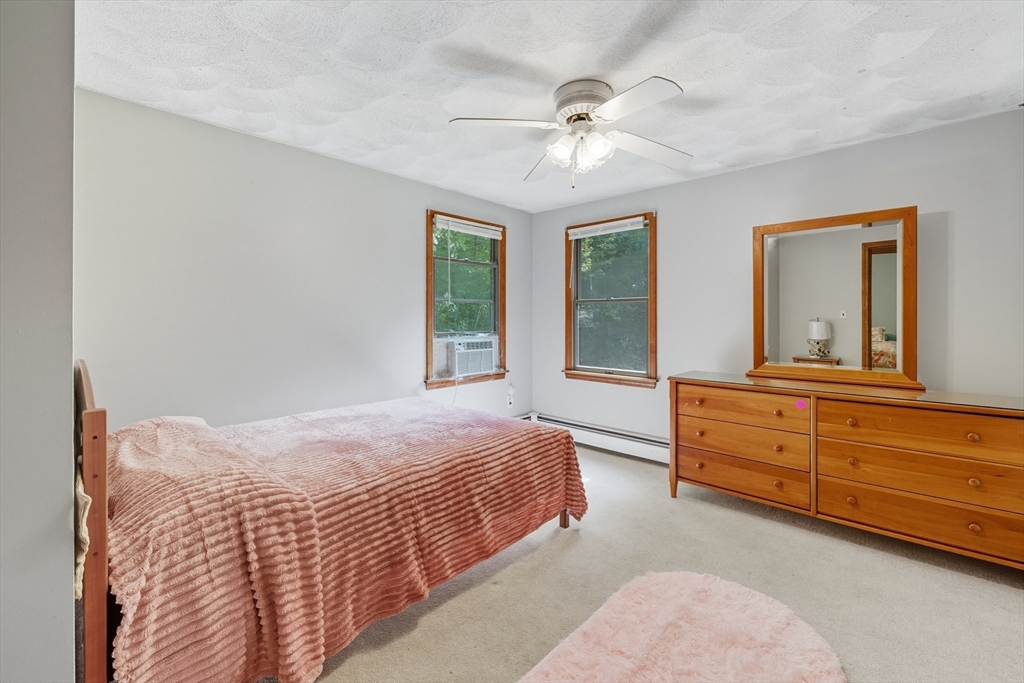 45 Red Gate Road Tyngsborough, MA 01879 - Photo 25 of 42 a bedroom with a bed and a dresser