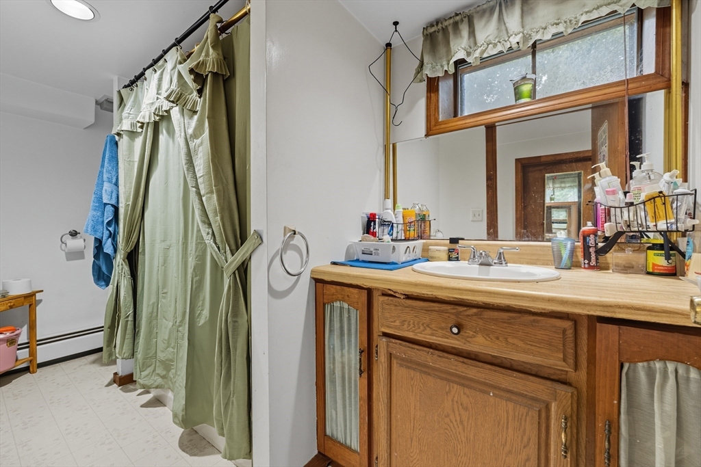45 Red Gate Road Tyngsborough, MA 01879 - Photo 34 of 42 a bathroom with a sink mirror and vanity