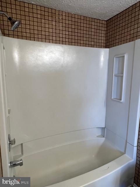 6627 Haydown Court Frederick, MD 21703 - Photo 16 of 30 a bathroom with a bathtub