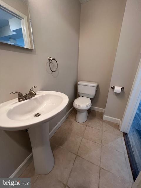 6627 Haydown Court Frederick, MD 21703 - Photo 29 of 30 a bathroom with a sink a toilet and a mirror