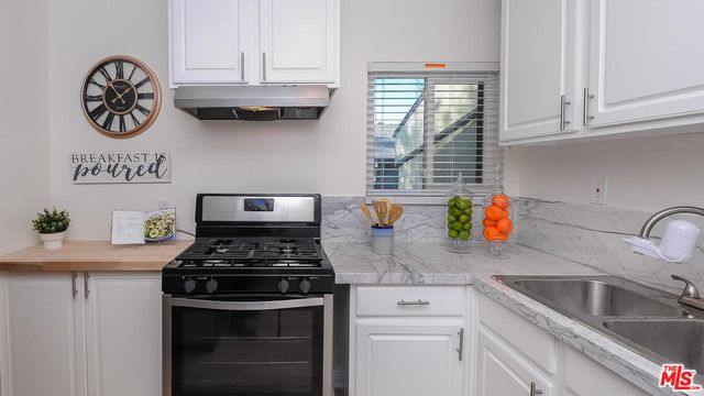 a kitchen with a stove and a sink