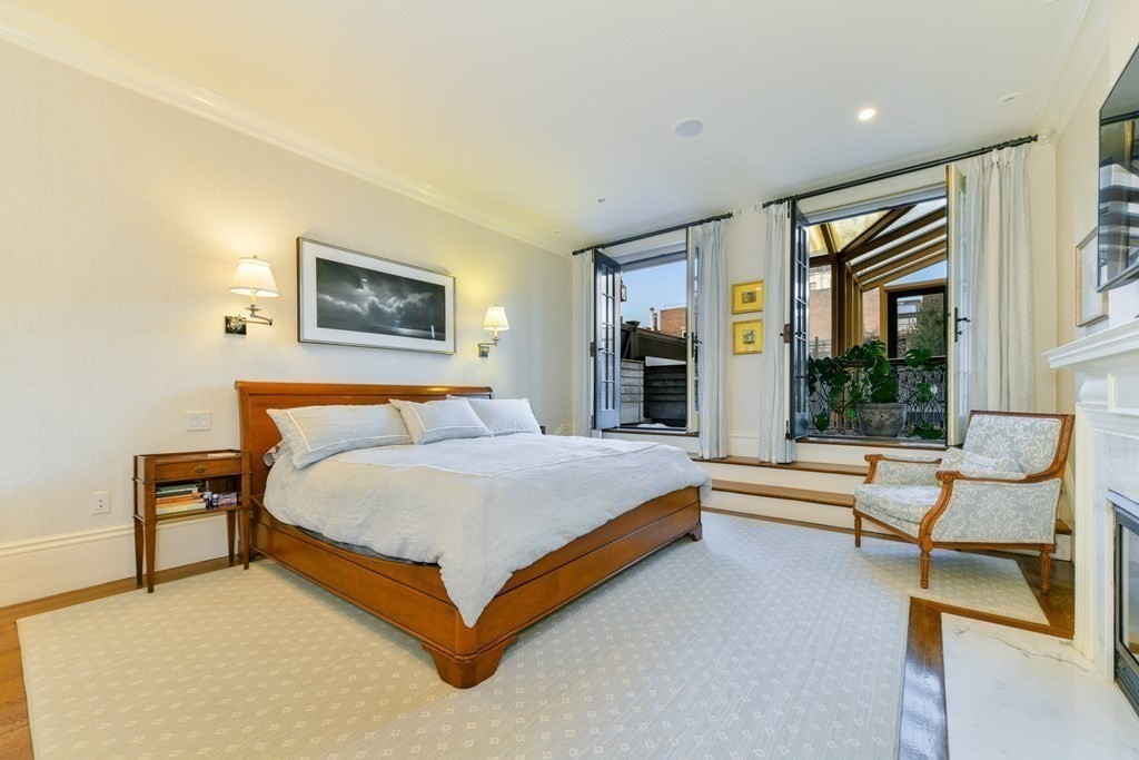 88 Beacon Street, Unit 3 Boston, MA 02108 - Photo 14 of 28 a bedroom with a bed and glass wall painting