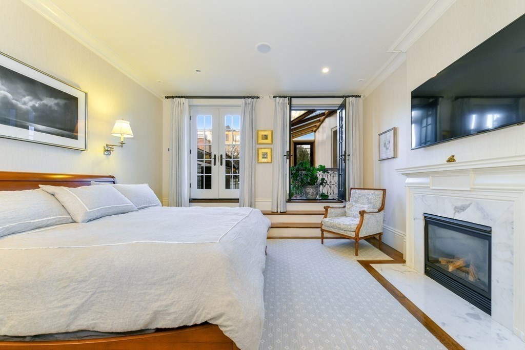 88 Beacon Street, Unit 3 Boston, MA 02108 - Photo 15 of 28 a bedroom with a bed and a flat screen tv