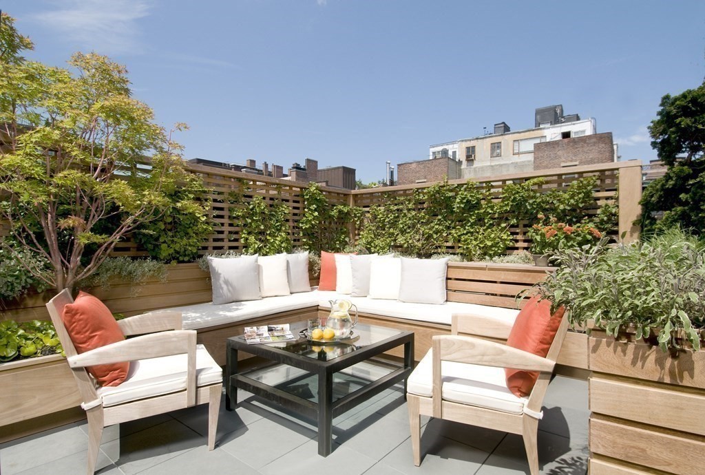 88 Beacon Street, Unit 3 Boston, MA 02108 - Photo 16 of 28 a roof deck with couches and wooden floor