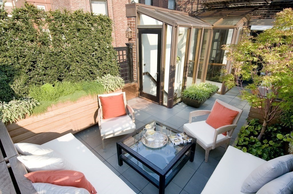 88 Beacon Street, Unit 3 Boston, MA 02108 - Photo 17 of 28 a view of a patio with couches table and chairs and potted plants
