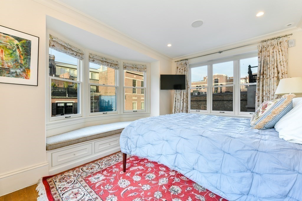 88 Beacon Street, Unit 3 Boston, MA 02108 - Photo 21 of 28 a bed room with a bed and a large window
