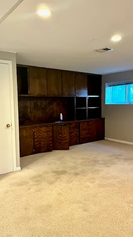 a view of an empty room with closet