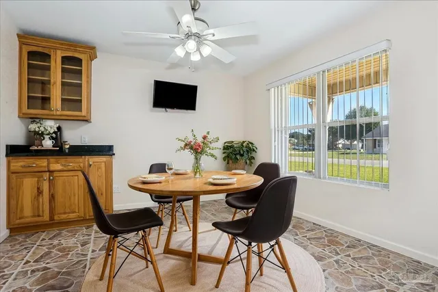 a kitchen with stainless steel appliances granite countertop a sink and stove top oven with granite countertops