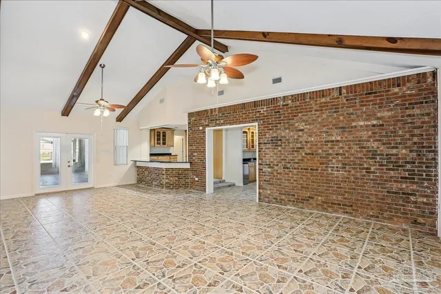 a view of room with a ceiling fan