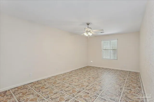a living room with furniture tv and large window