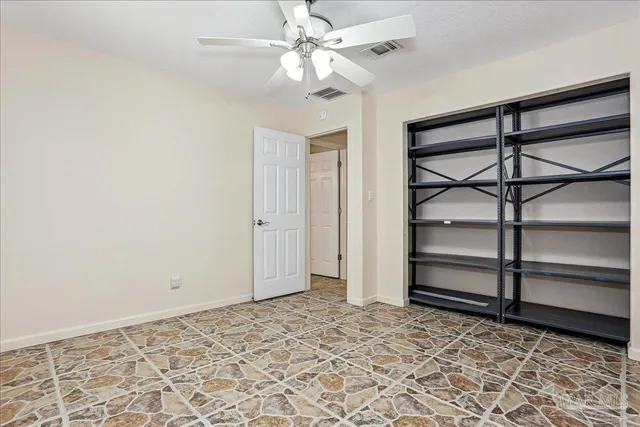 an aerial view of a house with a swimming pool