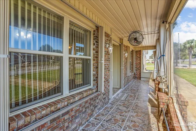 a view of empty room with a fireplace