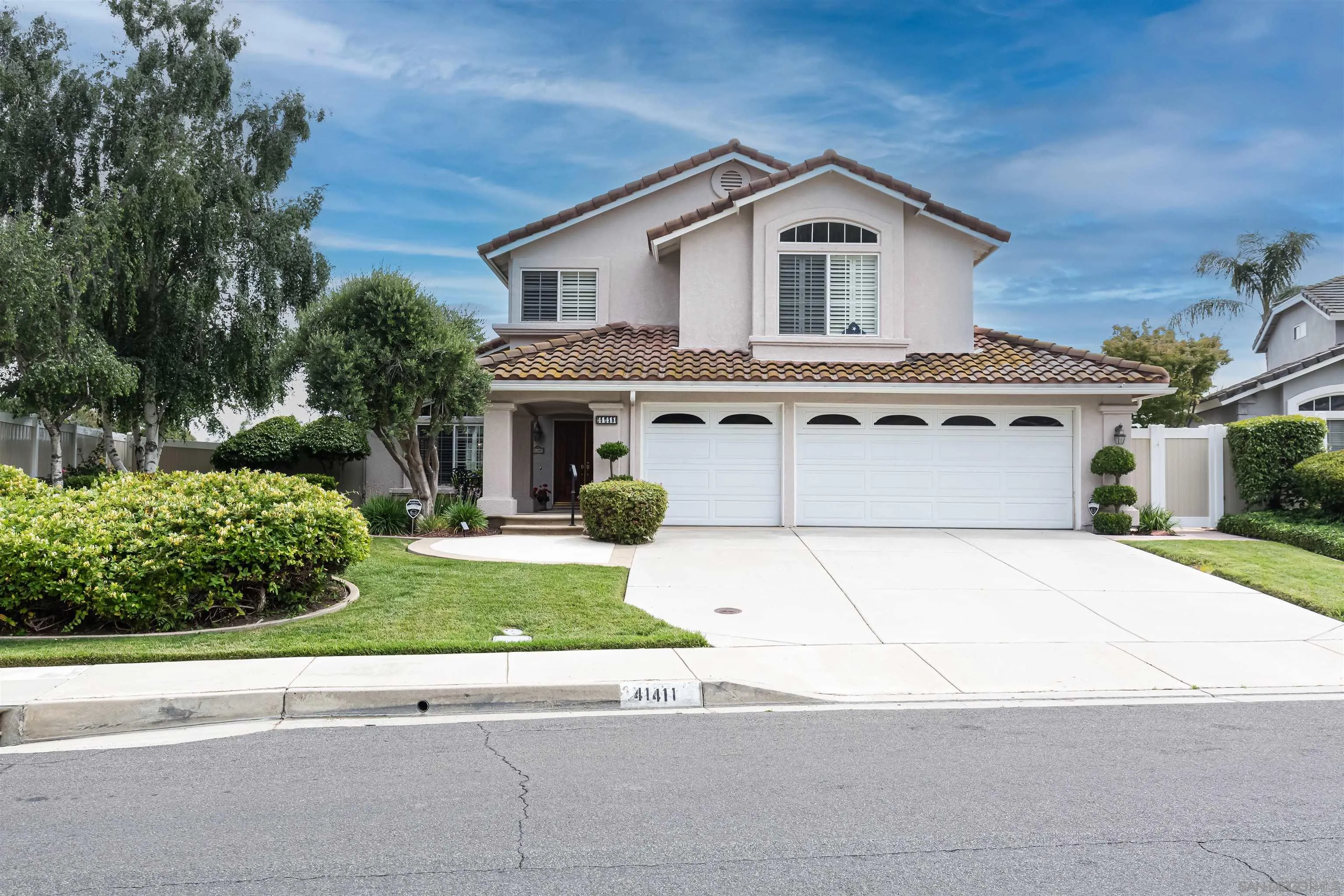 41411 Rue Jadot Temecula, CA 92591 - Photo 1 of 54 a front view of a house with a garden