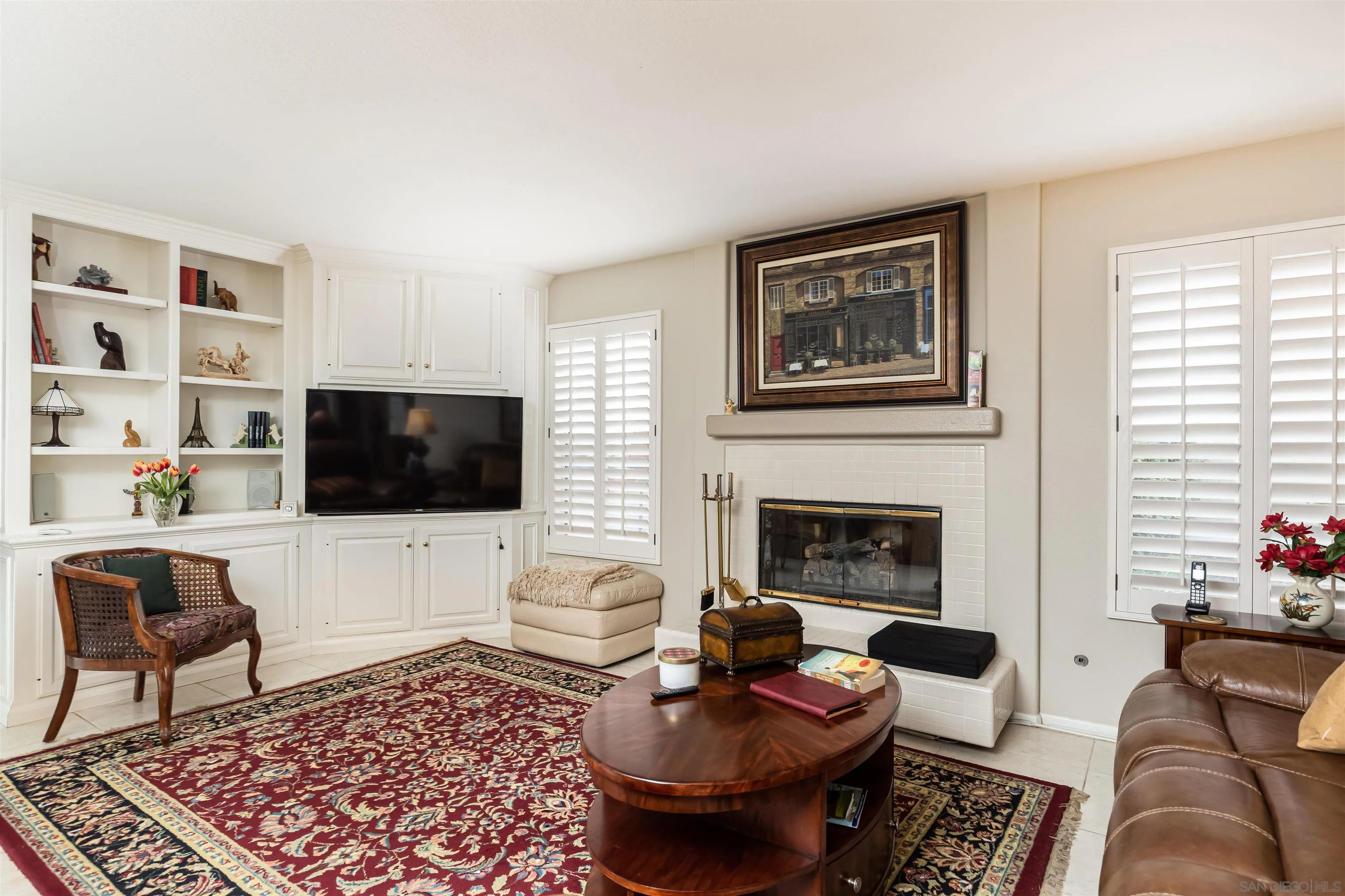 41411 Rue Jadot Temecula, CA 92591 - Photo 11 of 54 a living room with furniture a rug and a flat screen tv