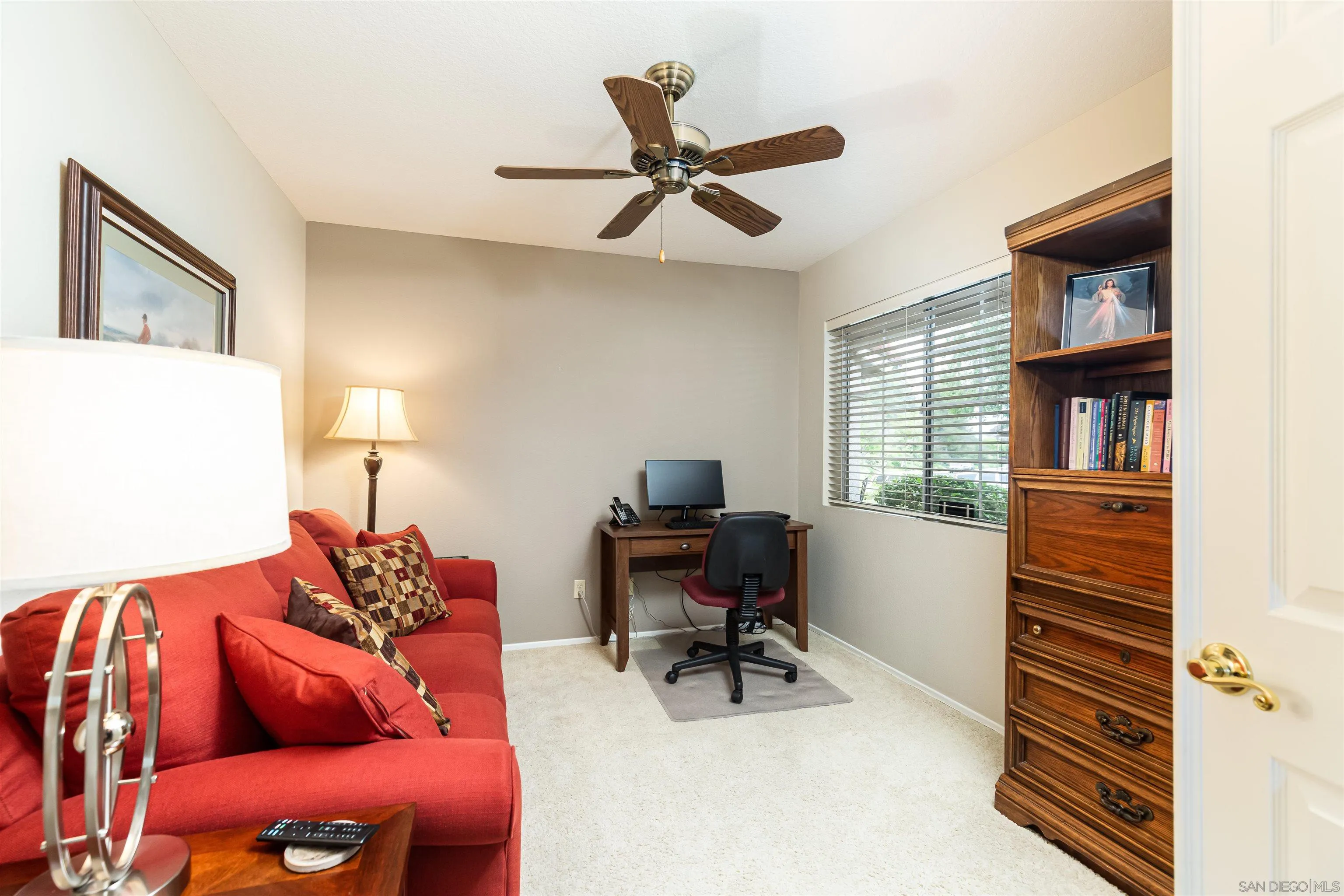 41411 Rue Jadot Temecula, CA 92591 - Photo 13 of 54 a workspace with furniture and a book shelf