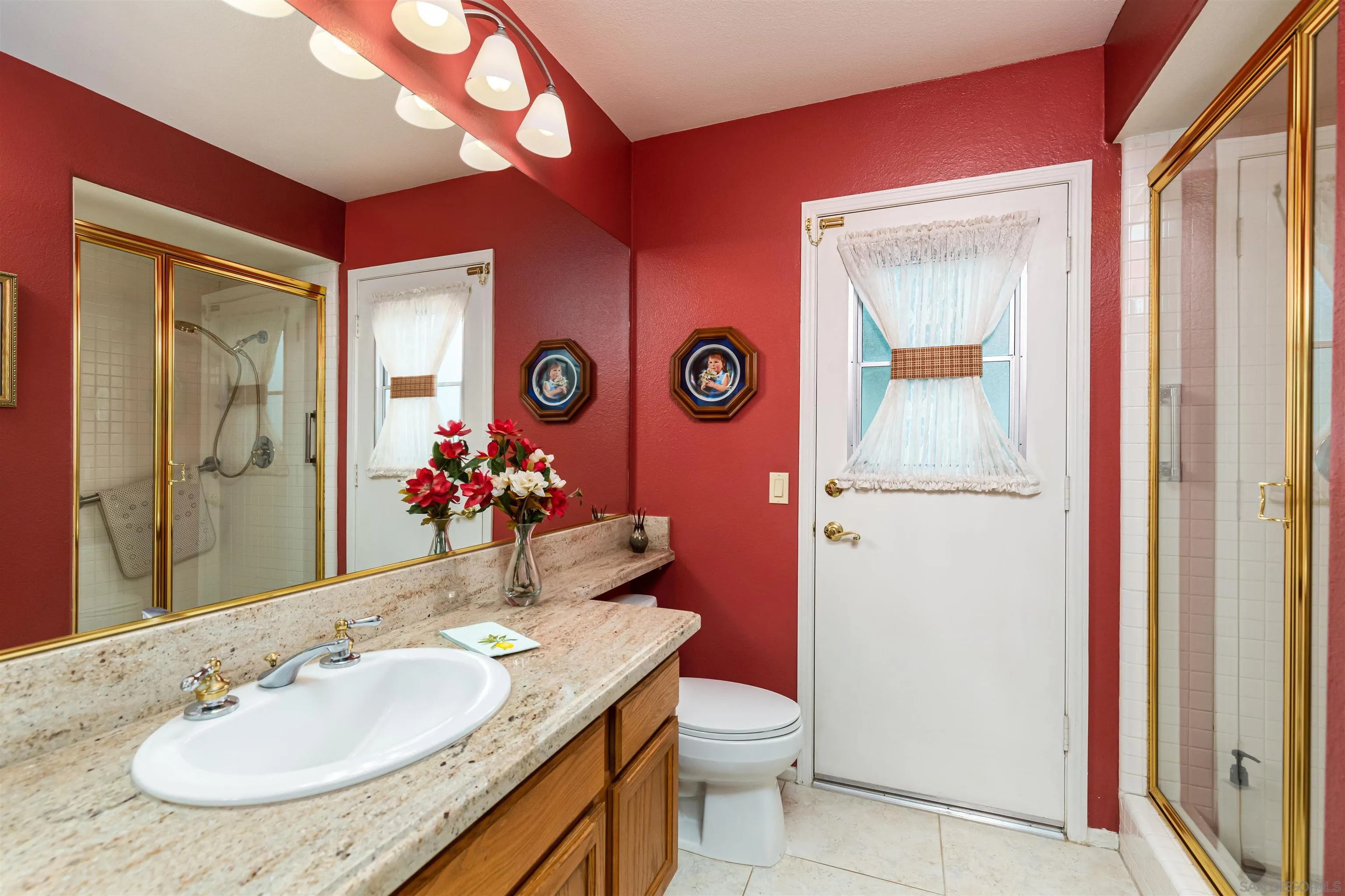 41411 Rue Jadot Temecula, CA 92591 - Photo 14 of 54 a bathroom with a sink vanity mirror and toilet