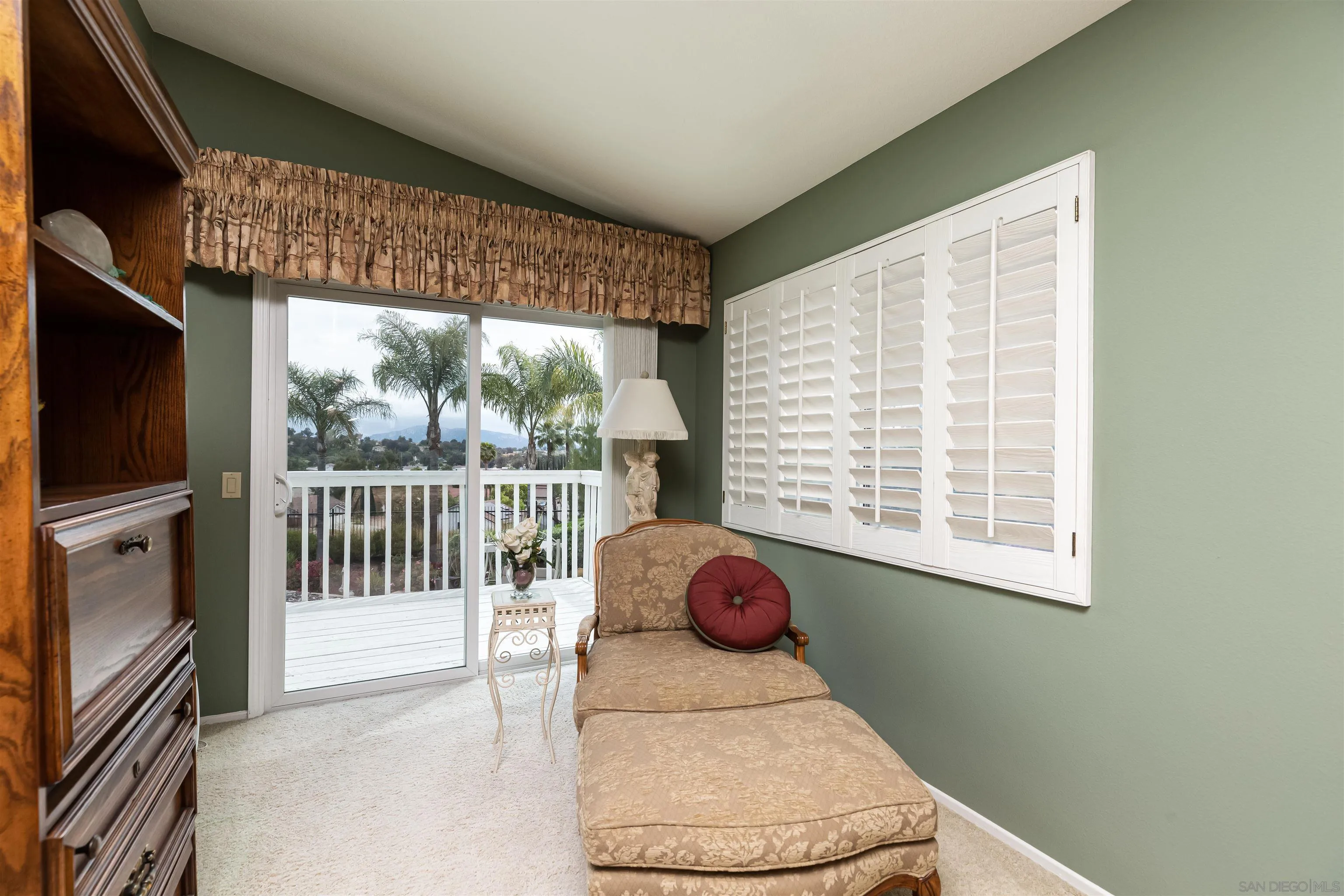 41411 Rue Jadot Temecula, CA 92591 - Photo 22 of 54 a living room with a large window and a flat screen tv