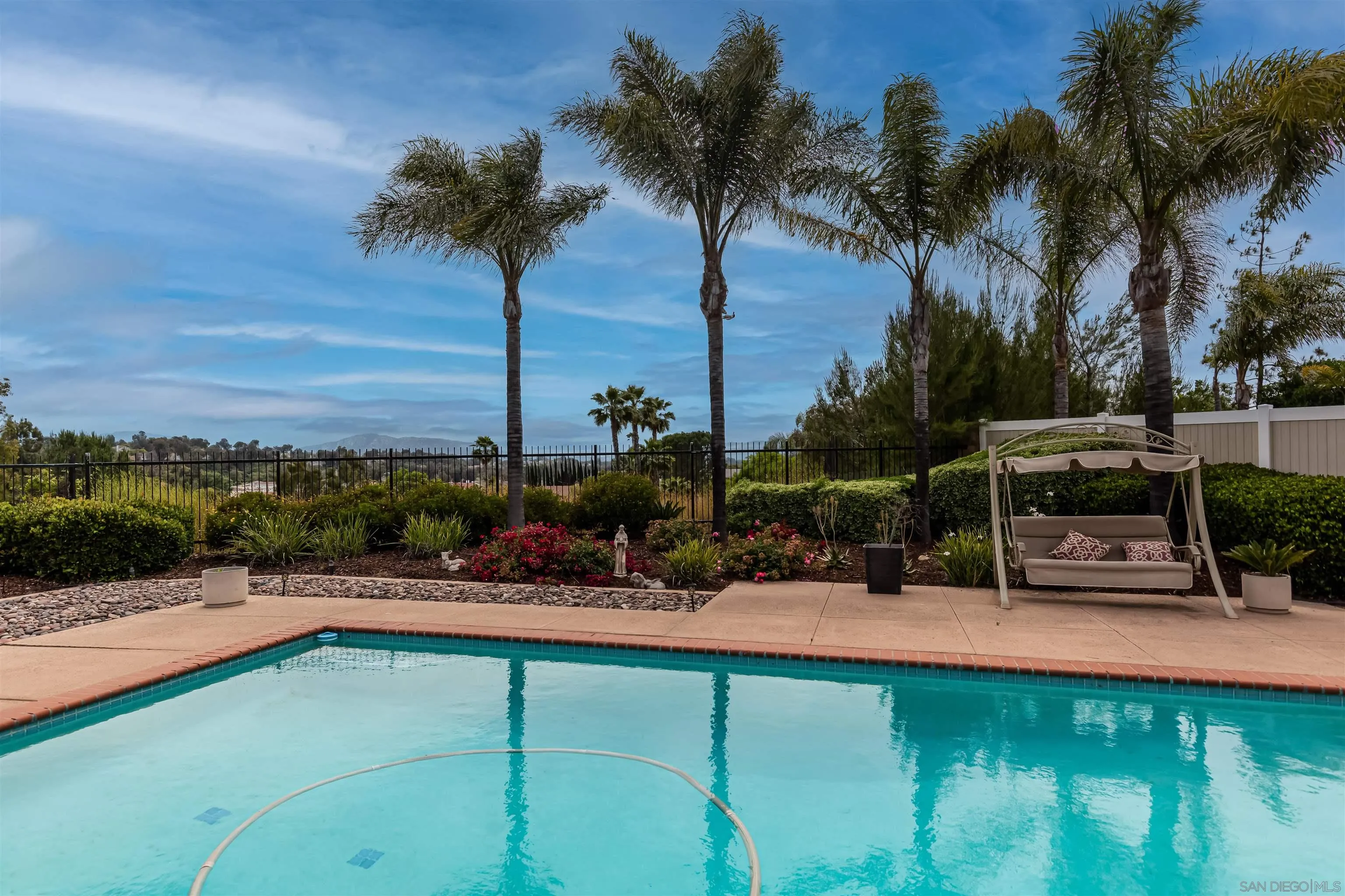 41411 Rue Jadot Temecula, CA 92591 - Photo 38 of 54 a swimming pool with outdoor seating and a garden