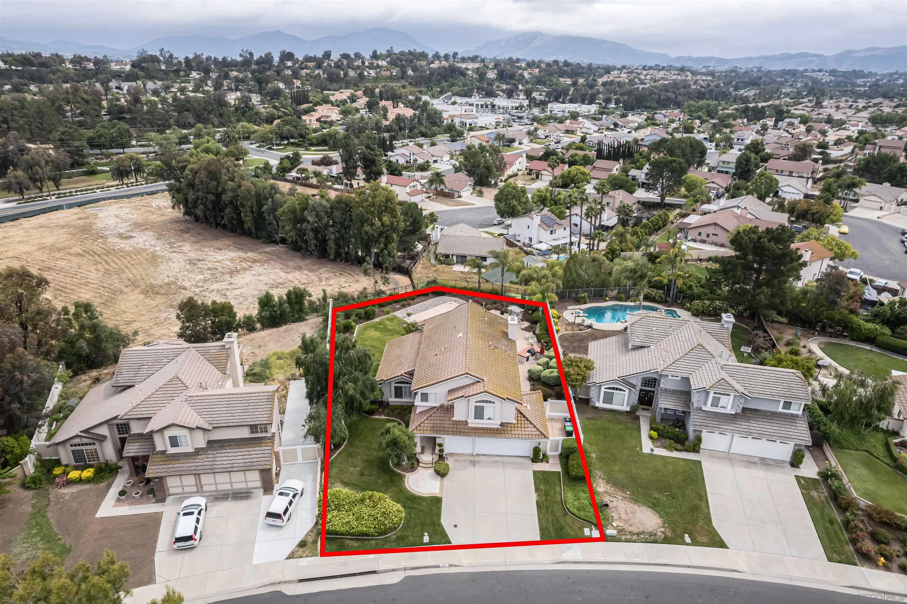41411 Rue Jadot Temecula, CA 92591 - Photo 43 of 54 an aerial view of residential houses with outdoor space and parking