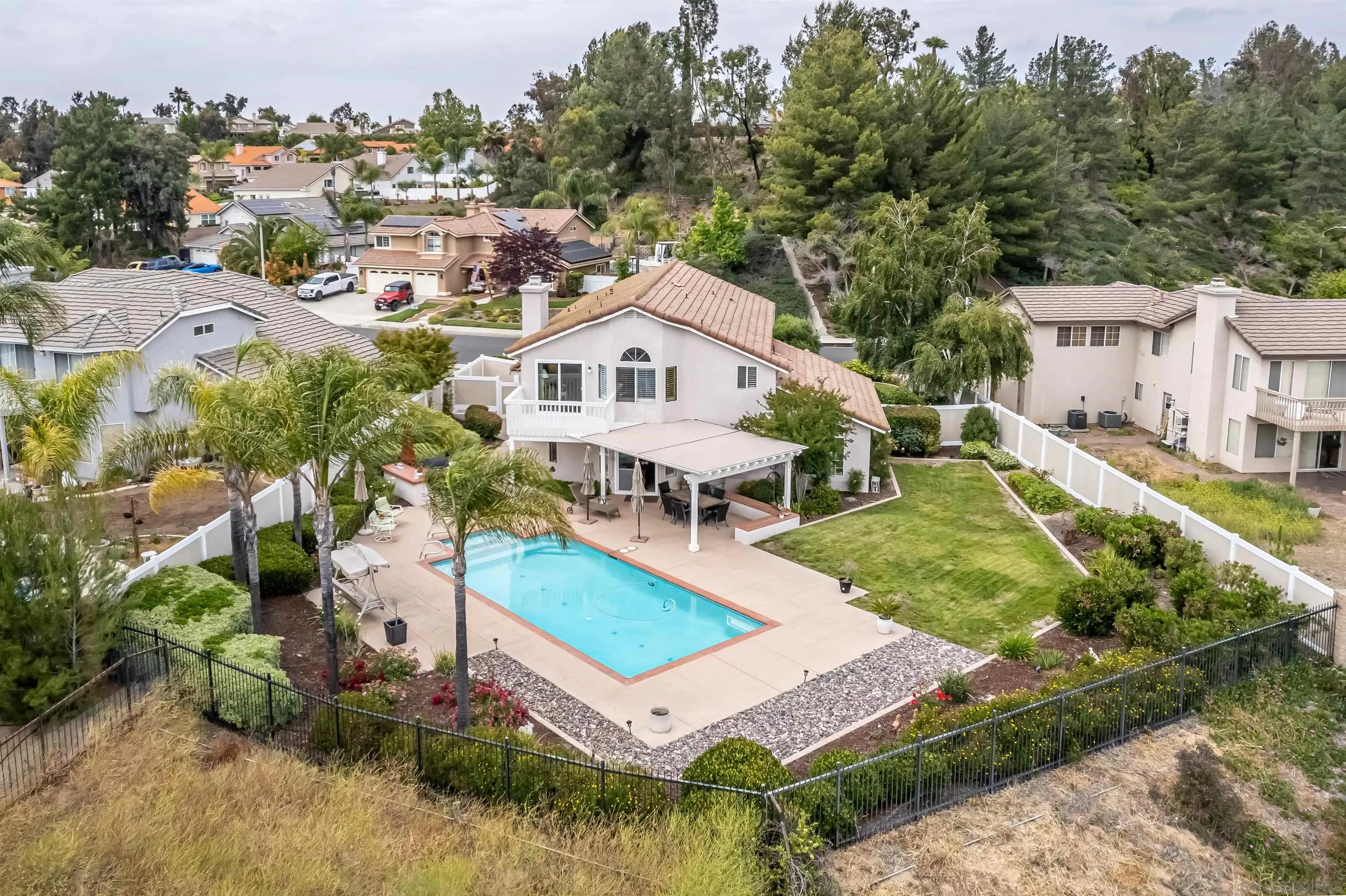 41411 Rue Jadot Temecula, CA 92591 - Photo 48 of 54 an aerial view of a house with a garden and swimming pool