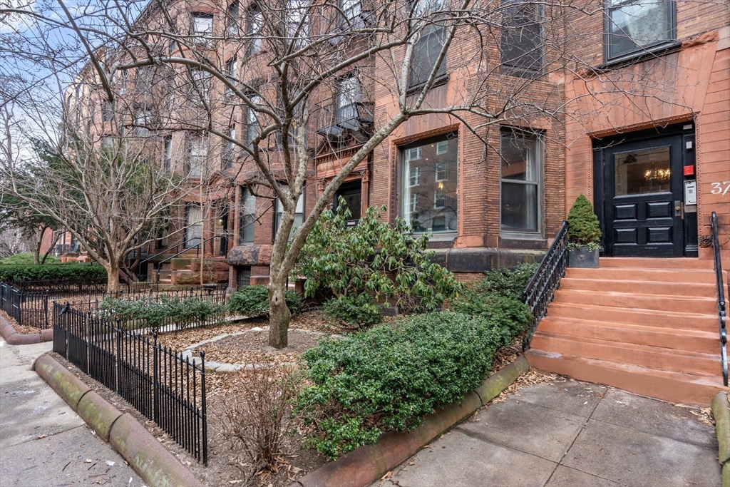 37 Bay State Road, Unit 3 Boston, MA 02215 - Photo 14 of 18 a view of a pathway with a house in the background