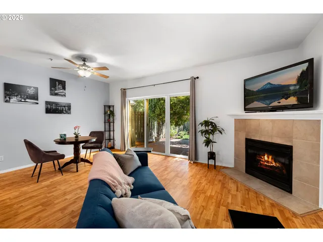 a living room with furniture fireplace and flat screen tv