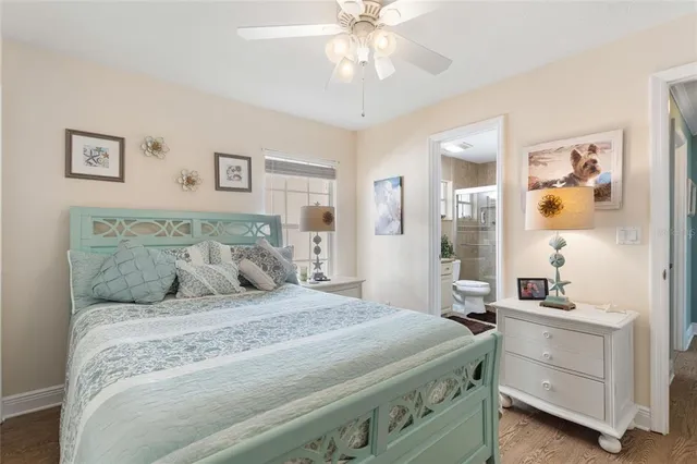 a bedroom with a bed and a table in it