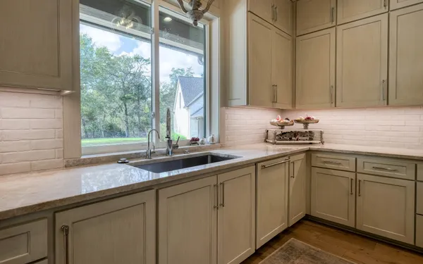 a kitchen with a sink and cabinets