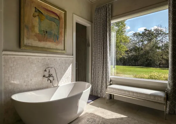 a bath tub sitting in front of a window