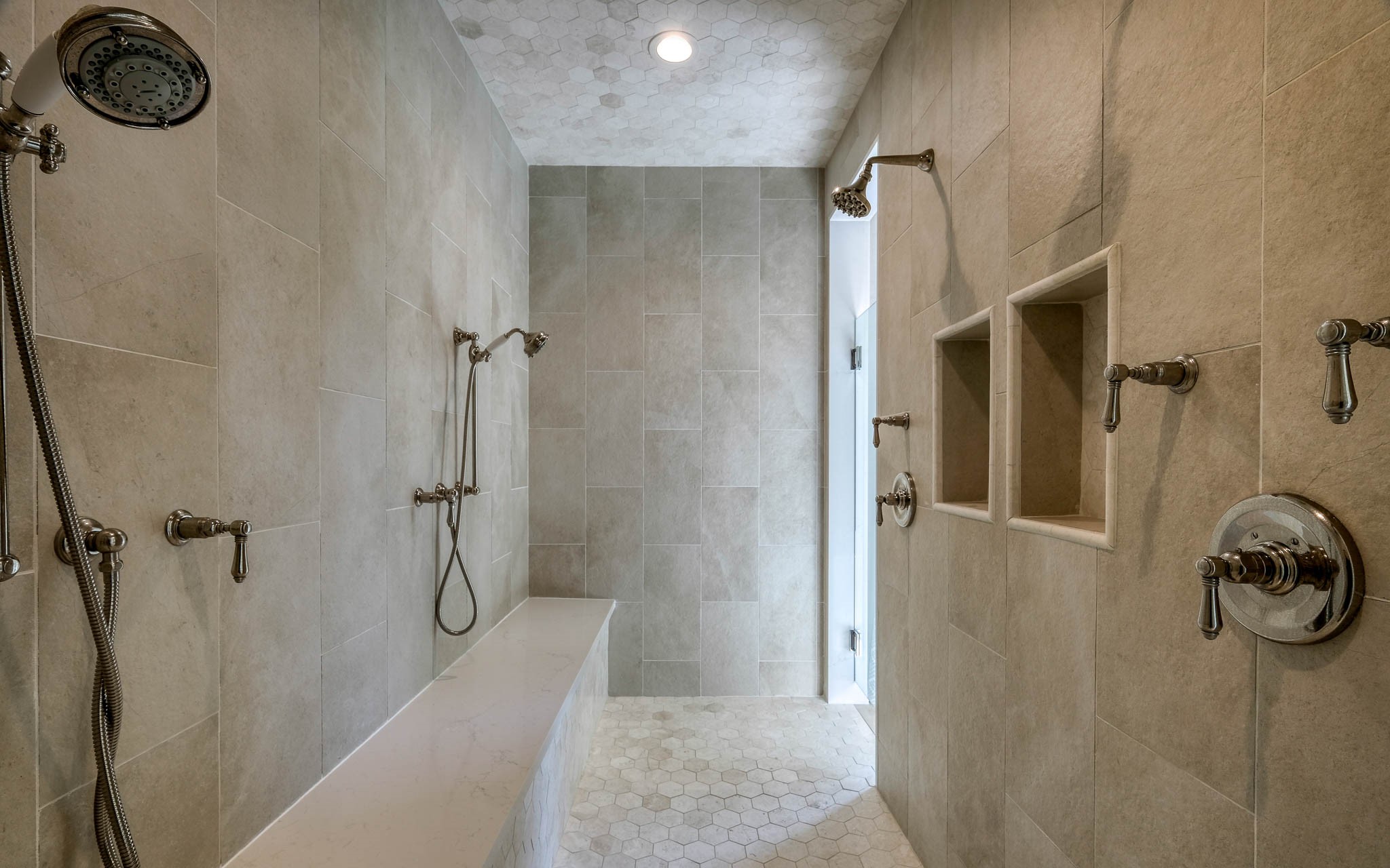 22474 Kmiec Road Hempstead, TX 77445 - Photo 25 of 50 Four shower heads plus rainfall shower head make this large walk-in shower a pleasure to be in.