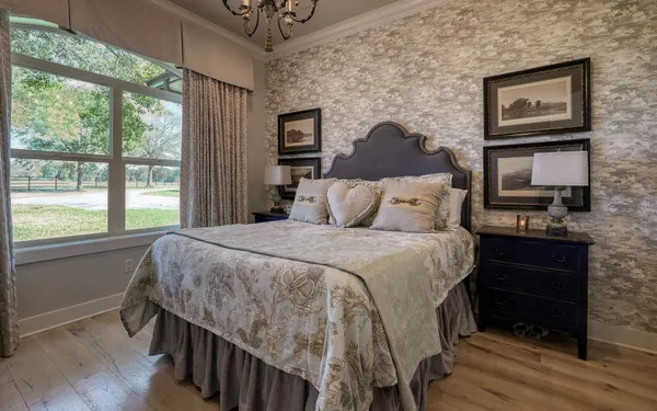 a bedroom with a bed and a tv on table
