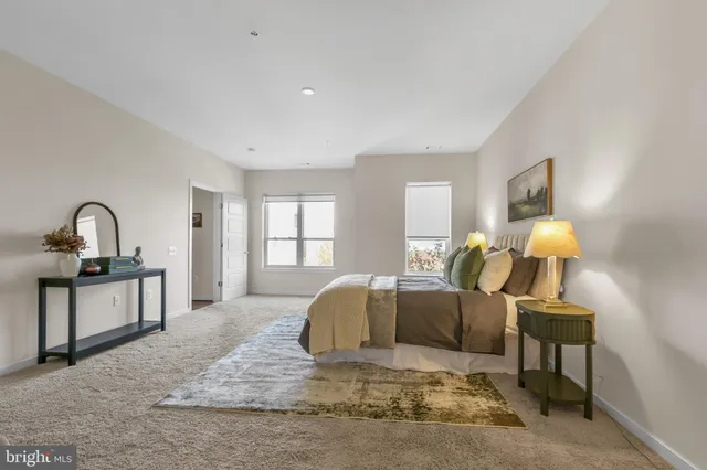 a bathroom with a granite countertop sink a toilet and bathtub