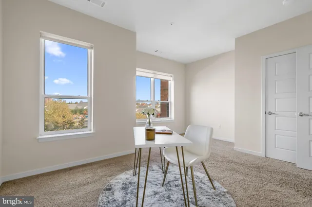 a kitchen with stainless steel appliances granite countertop a refrigerator stove and sink