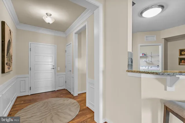 a bathroom with a granite countertop sink a mirror a bathtub and shower