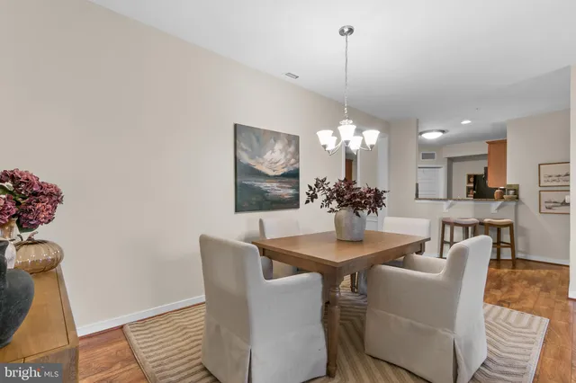 a view of a kitchen with kitchen island a large window a sink and a lots of counter space