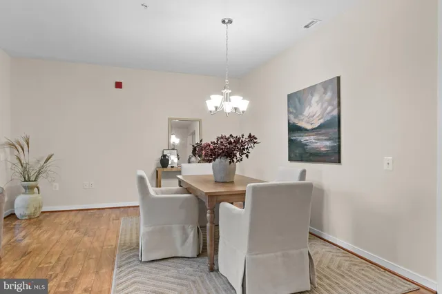 a kitchen with stainless steel appliances granite countertop a stove and a refrigerator