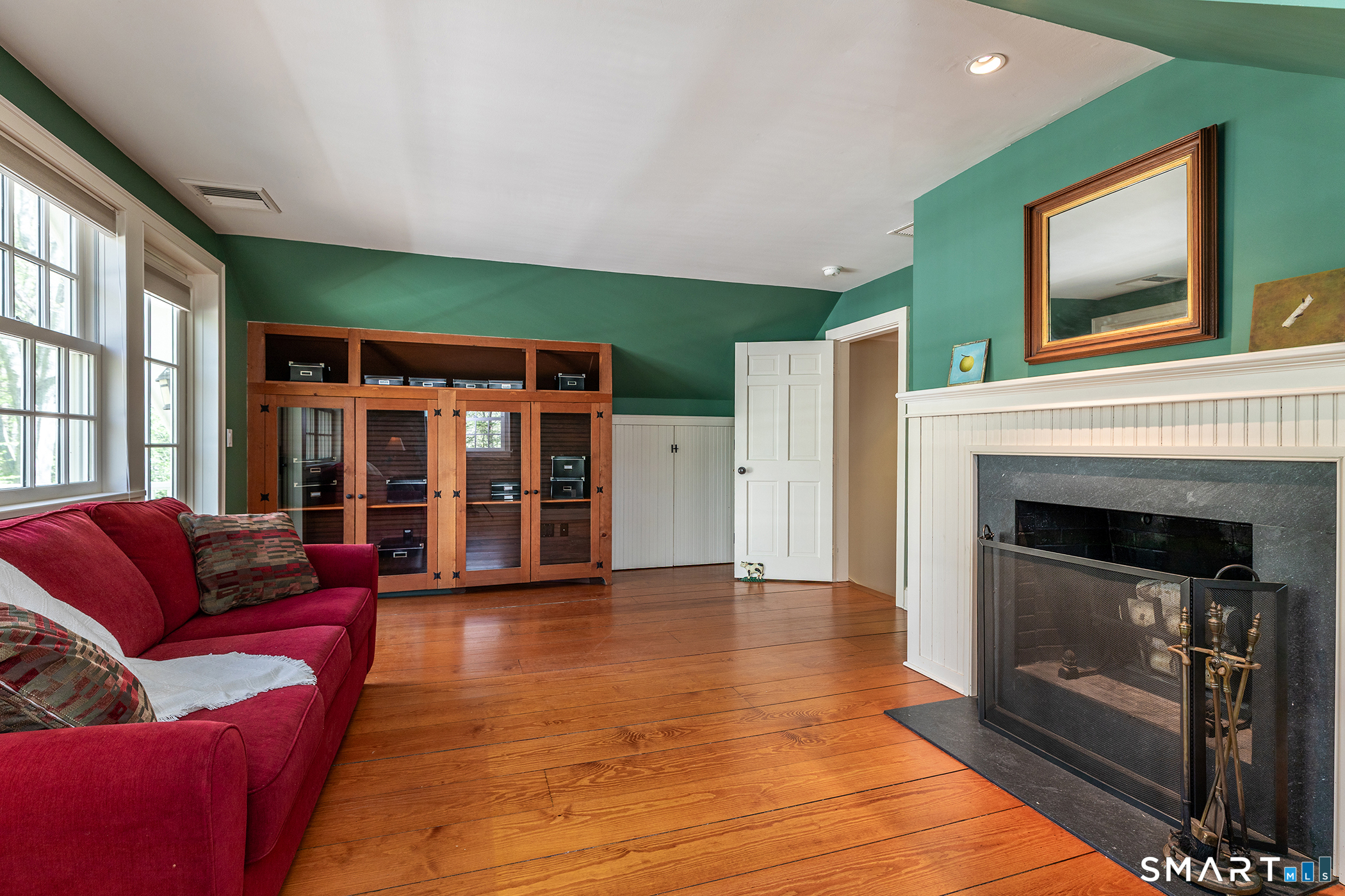 18 Curtis Road Washington, CT 06793 - Photo 21 of 32 Second floor bedroom with fireplace and French door to mahogany deck
