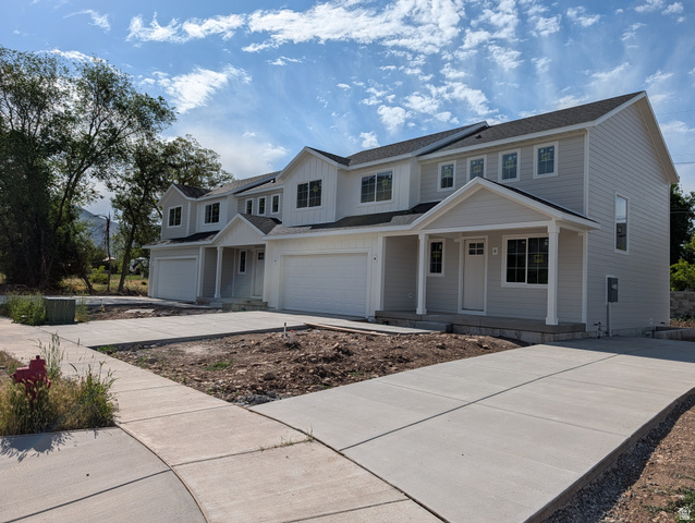 626 East 800 S Street, Unit 16 Springville, UT 84663 - Photo 1 of 6 Newly constructed multi-unit property featuring light-colored siding, multiple windows, attached garages, covered entryways, and concrete driveways