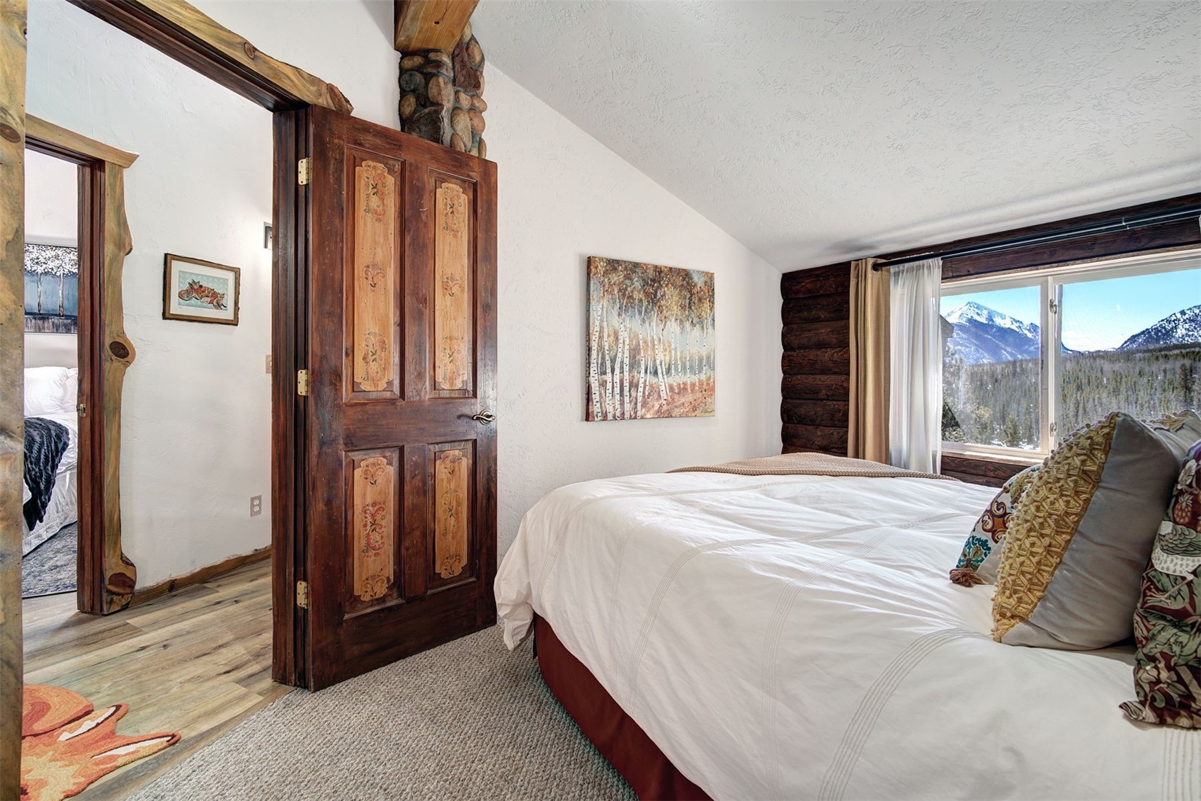 9460 Ryan Gulch Road, Unit 9460 Silverthorne, CO 80498 - Photo 20 of 39 a bedroom with a bed and a large window