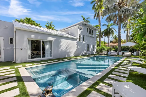 a view of swimming pool with chairs