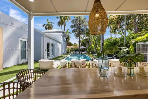 a view of balcony with furniture and garden